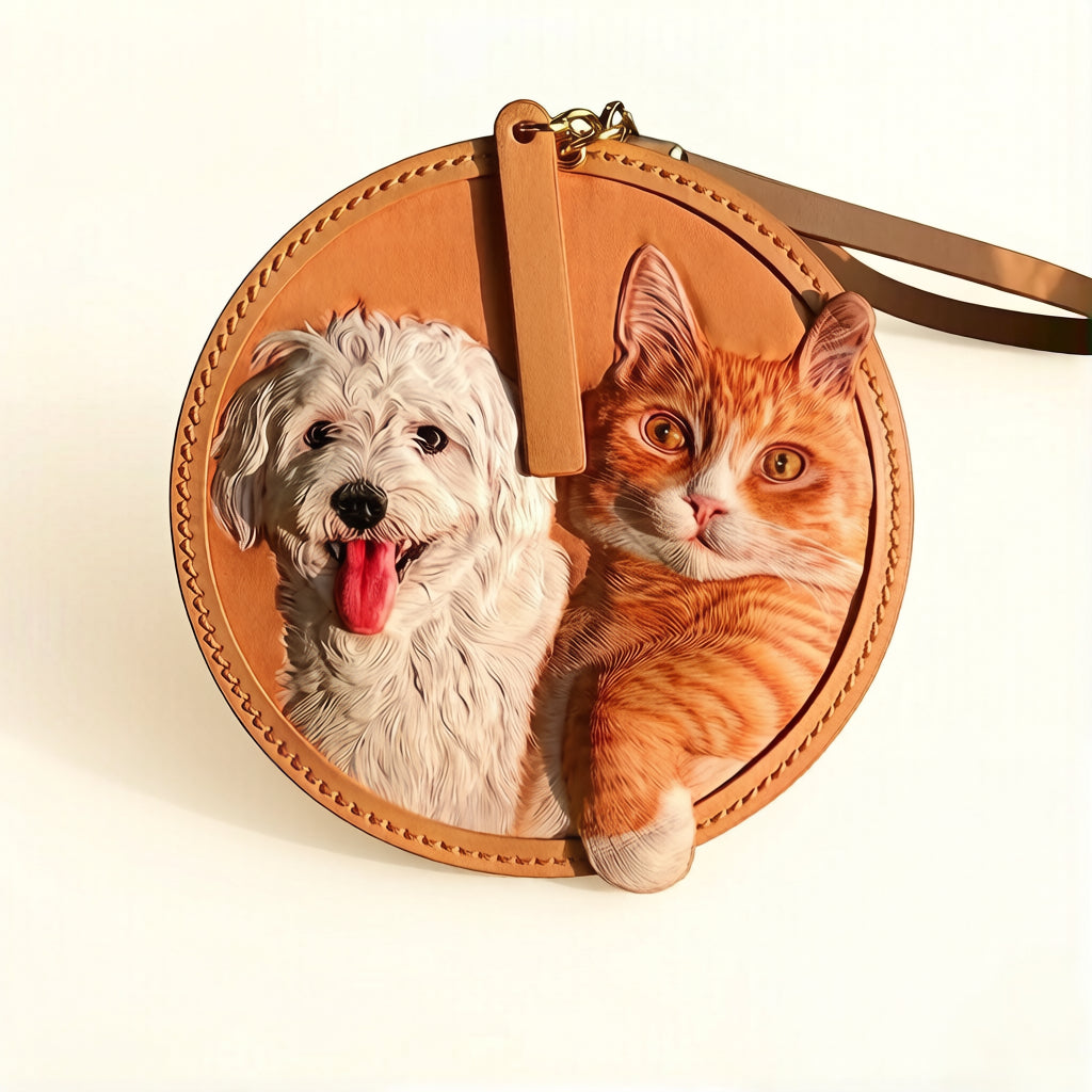 Personalized Pet Leather Keychain featuring a white dog and an orange tabby cat, unique pet accessory