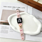 personalized apple watch band with custom dog photo on pink silicone strap on desk