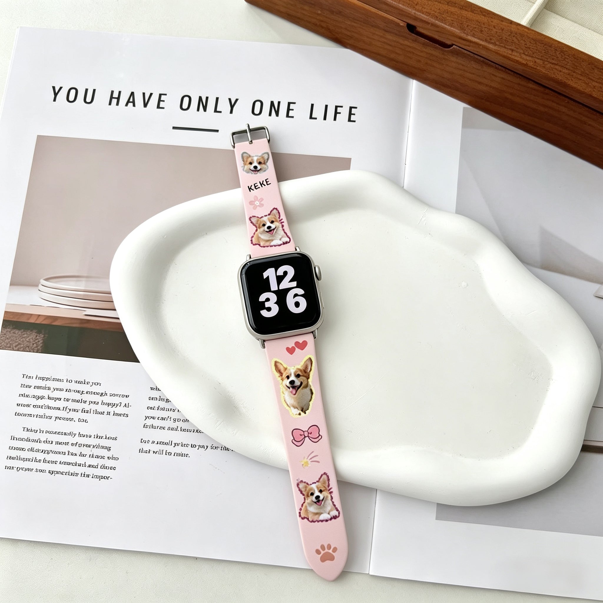 personalized apple watch band with custom dog photo on pink silicone strap on desk