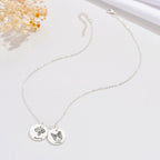 Silver personalized pet memorial necklace with engraved cat and dog charms on white background